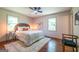 Comfortable bedroom with hardwood floors, natural lighting, and a ceiling fan at 3219 W Manor Ln, Atlanta, GA 30311