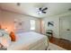 Bright bedroom with hardwood floors, a ceiling fan, and natural light at 3219 W Manor Ln, Atlanta, GA 30311