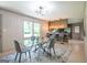 Elegant dining room offers a clear view to the kitchen, modern lighting, and neutral tones at 3219 W Manor Ln, Atlanta, GA 30311