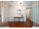 Elegant foyer featuring hardwood floors, modern lighting, and a stylish console table with decor at 3219 W Manor Ln, Atlanta, GA 30311