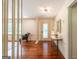 Bright foyer with hardwood floors, decorative lighting, and stylish accents that create a welcoming atmosphere at 3219 W Manor Ln, Atlanta, GA 30311