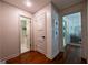 Hallway with hardwood floors and access to bathroom and living area at 3219 W Manor Ln, Atlanta, GA 30311