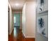 Long hallway featuring hardwood floors and neutral walls at 3219 W Manor Ln, Atlanta, GA 30311
