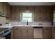 A well-lit kitchen featuring stainless steel appliances, custom cabinetry and bright white countertops at 3219 W Manor Ln, Atlanta, GA 30311
