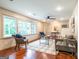 Airy living room with hardwood floors, recessed lighting, ample natural light, and neutral color scheme at 3219 W Manor Ln, Atlanta, GA 30311