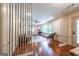 Inviting living room featuring hardwood floors, neutral paint, large windows, and modern furnishings at 3219 W Manor Ln, Atlanta, GA 30311