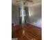 This bedroom is bright with natural light and offers beautiful hardwood floors at 341 Boxwood St, Social Circle, GA 30025