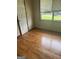 Bedroom with wood floors and a window at 341 Boxwood St, Social Circle, GA 30025
