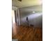 Living room with hardwood floors, light gray walls, and an open doorway creates an inviting and spacious atmosphere at 341 Boxwood St, Social Circle, GA 30025