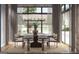 Modern dining room with large windows and a beautiful light fixture at 0 Ebenezer Rd # 4, Fayetteville, GA 30215