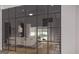 Open-concept living space with glass walls and staircase at 0 Ebenezer Rd # 4, Fayetteville, GA 30215