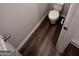 Compact bathroom with vinyl floors and standard toilet at 116 Deer Xing, Temple, GA 30179