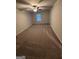 Large bedroom with a ceiling fan and carpet at 116 Deer Xing, Temple, GA 30179