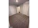 This bedroom offers neutral carpet, a ceiling light, and standard doors at 116 Deer Xing, Temple, GA 30179