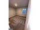A standard bedroom features neutral carpet and a window for natural light at 116 Deer Xing, Temple, GA 30179