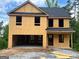 Two-story home under construction with a garage at 116 Deer Xing, Temple, GA 30179