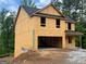 Unfinished two-story home with a two-car garage at 116 Deer Xing, Temple, GA 30179