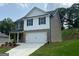 Lovely two-story home with attached two-car garage, manicured lawn, and mixed siding at 116 Deer Xing, Temple, GA 30179