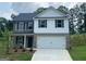 Charming two-story home with a two-car garage and a well-manicured front yard at 116 Deer Xing, Temple, GA 30179
