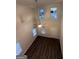 Vaulted ceiling, ceiling fan, and wood floor in living room at 116 Deer Xing, Temple, GA 30179