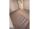 A bedroom with neutral carpet, light gray walls and a walk in closet at 116 Deer Xing, Temple, GA 30179
