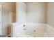 The primary bathroom features a large tiled tub at 2635 Carolina Rdg, Riverdale, GA 30296