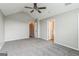 Bright bedroom with two doorways, large window, neutral walls, and ceiling fan at 2635 Carolina Rdg, Riverdale, GA 30296