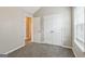Cozy bedroom features plush carpet, a large closet, and ample natural light from a window at 2635 Carolina Rdg, Riverdale, GA 30296