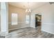 Bright dining room featuring modern floors, neutral paint, and seamless kitchen access at 2635 Carolina Rdg, Riverdale, GA 30296