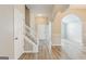Welcoming foyer featuring hardwood floors, staircase, and an archway to the living room at 2635 Carolina Rdg, Riverdale, GA 30296