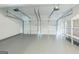 An empty two-car garage with shelves at 2635 Carolina Rdg, Riverdale, GA 30296