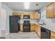Modern kitchen features updated appliances, granite counters, and plenty of cabinet space at 2635 Carolina Rdg, Riverdale, GA 30296