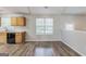 Bright kitchen features light wood cabinets, sleek appliances, and hardwood floors at 2635 Carolina Rdg, Riverdale, GA 30296