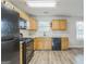 Well-equipped kitchen featuring modern appliances, granite counters, and updated cabinetry at 2635 Carolina Rdg, Riverdale, GA 30296