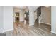 Open concept living space featuring hardwood floors, archways, and seamless flow to the kitchen at 2635 Carolina Rdg, Riverdale, GA 30296