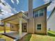 Exterior view of home featuring a covered patio, and a well-manicured lawn at 513 Cherry Creek Dr, Loganville, GA 30052