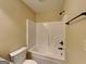 White fiberglass tub/shower combo unit with bronze fixtures at 513 Cherry Creek Dr, Loganville, GA 30052