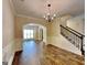 Formal dining area featuring chair rail, modern chandelier, and an open layout at 513 Cherry Creek Dr, Loganville, GA 30052