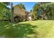 Back of home featuring a deck, sunroom, and grassy backyard at 423 Holly Grove Church Rd, Peachtree City, GA 30269