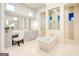Bathroom with tub, dual vanities, mirrors, and natural light at 105 Godby Dr, Fayetteville, GA 30215