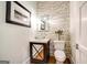 Powder room featuring stone accents, modern sink bowl and fixtures at 105 Godby Dr, Fayetteville, GA 30215