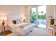 Bright bedroom featuring a plush bed, sliding glass doors to balcony, and modern decor at 105 Godby Dr, Fayetteville, GA 30215