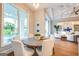 The dining area boasts natural light and views to the pool, creating a serene and inviting atmosphere at 105 Godby Dr, Fayetteville, GA 30215