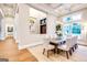 Dining room with large windows and view, light gray walls and decorative light fixture at 105 Godby Dr, Fayetteville, GA 30215