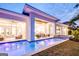 Luxury home displaying a modern design, an inviting pool, and lush landscaping at 105 Godby Dr, Fayetteville, GA 30215