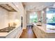 Modern kitchen featuring stainless steel appliances, wooden floors and white cabinets at 105 Godby Dr, Fayetteville, GA 30215