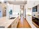 Bright kitchen with stainless steel appliances, a center island, hardwood floors, and white cabinets at 105 Godby Dr, Fayetteville, GA 30215