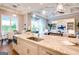 This gourmet kitchen showcases a large island with seating, white cabinets, and stainless steel appliances at 105 Godby Dr, Fayetteville, GA 30215