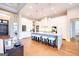 A modern white kitchen with an island featuring stylish seating and high-end appliances, perfect for cooking and entertaining at 105 Godby Dr, Fayetteville, GA 30215