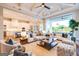 Bright and airy living room with comfortable seating, open to the modern kitchen and patio at 105 Godby Dr, Fayetteville, GA 30215